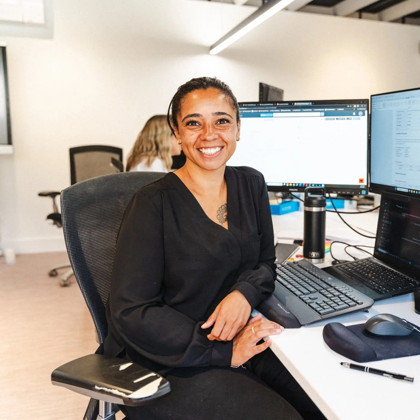 A Roost adviser at her desk in the office